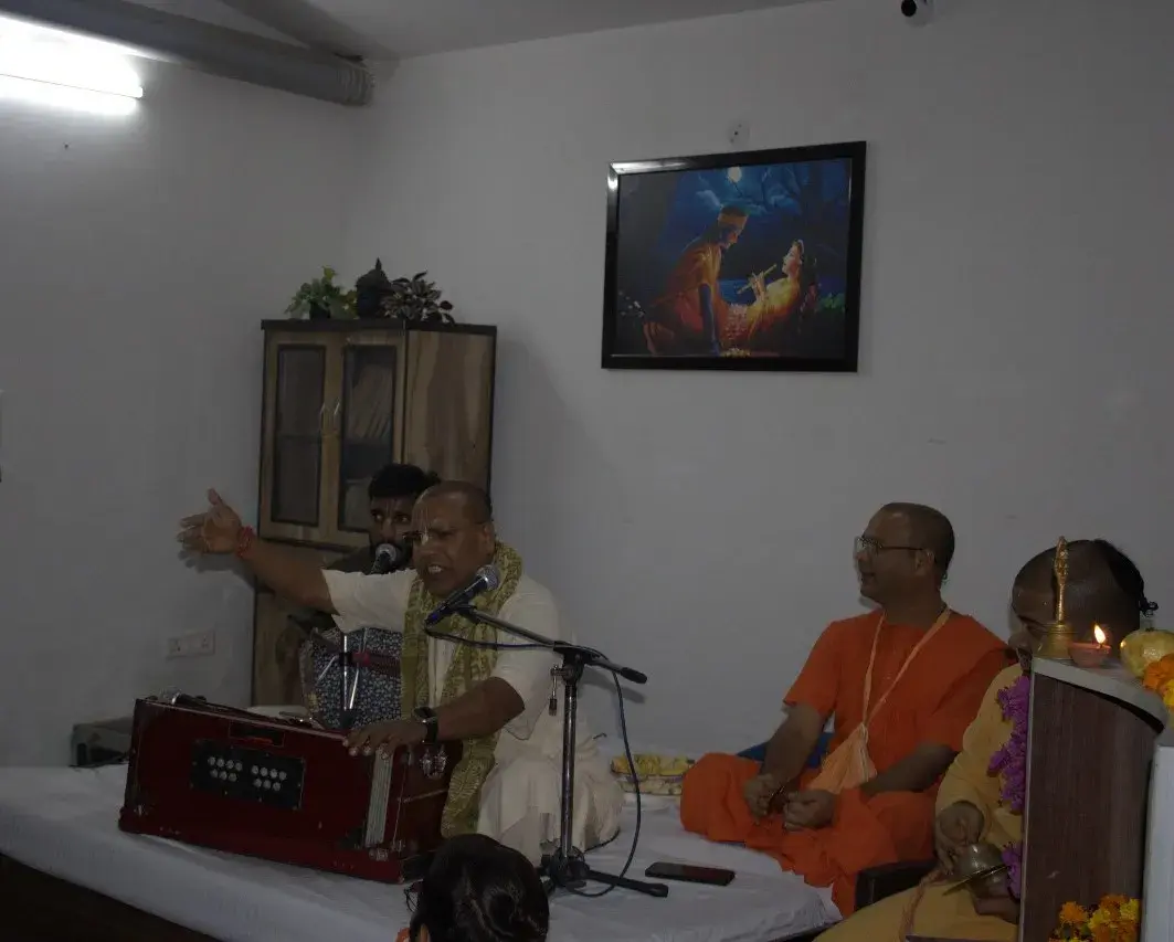 Elders clapping and singing during Bhajan Kirtan