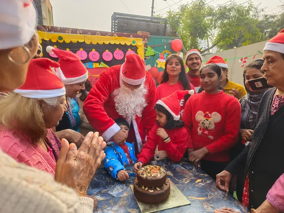 Residents unwrapping Christmas gifts at Ashirwad Elders Home