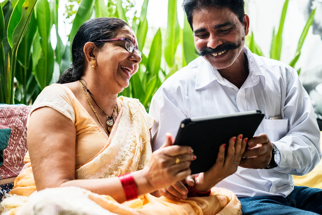 Residents of Ashirwad Elders Home participating in a group activity, smiling and enjoying each other’s company.
