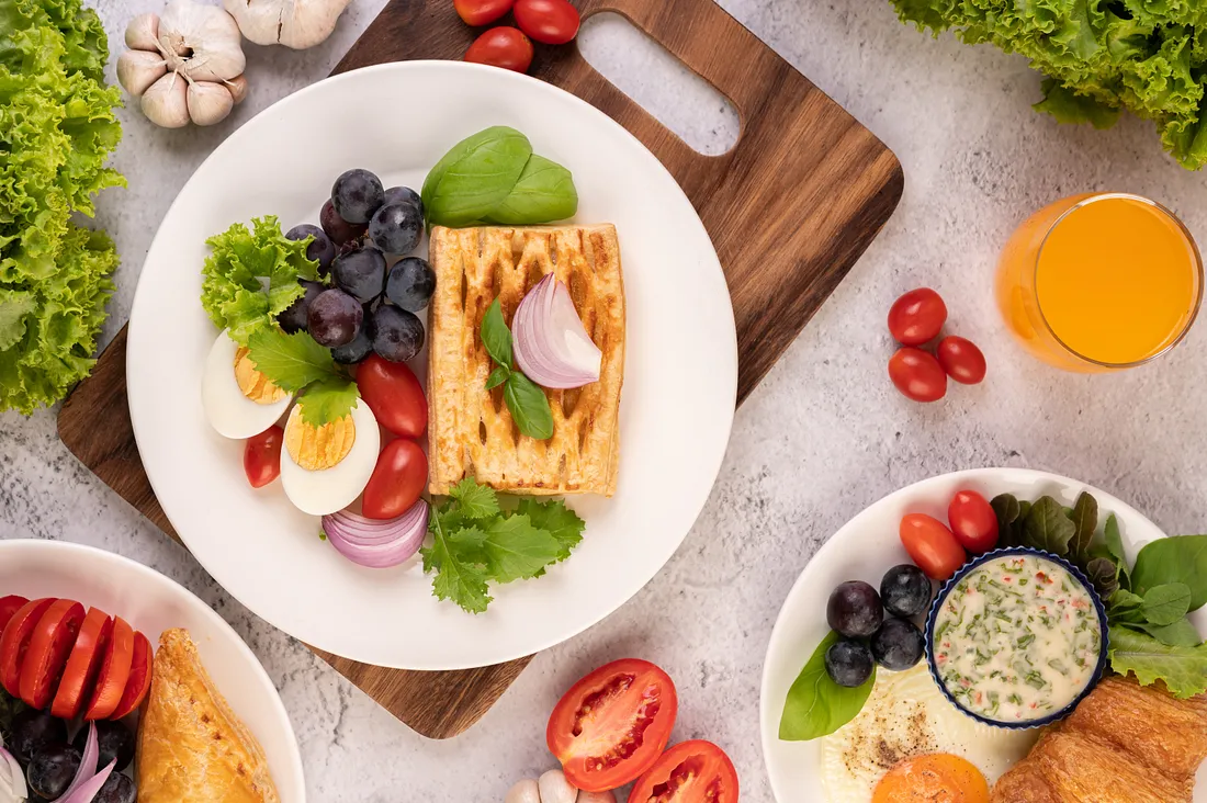 A nutritious breakfast platter with fresh fruits, toast, and herbal tea