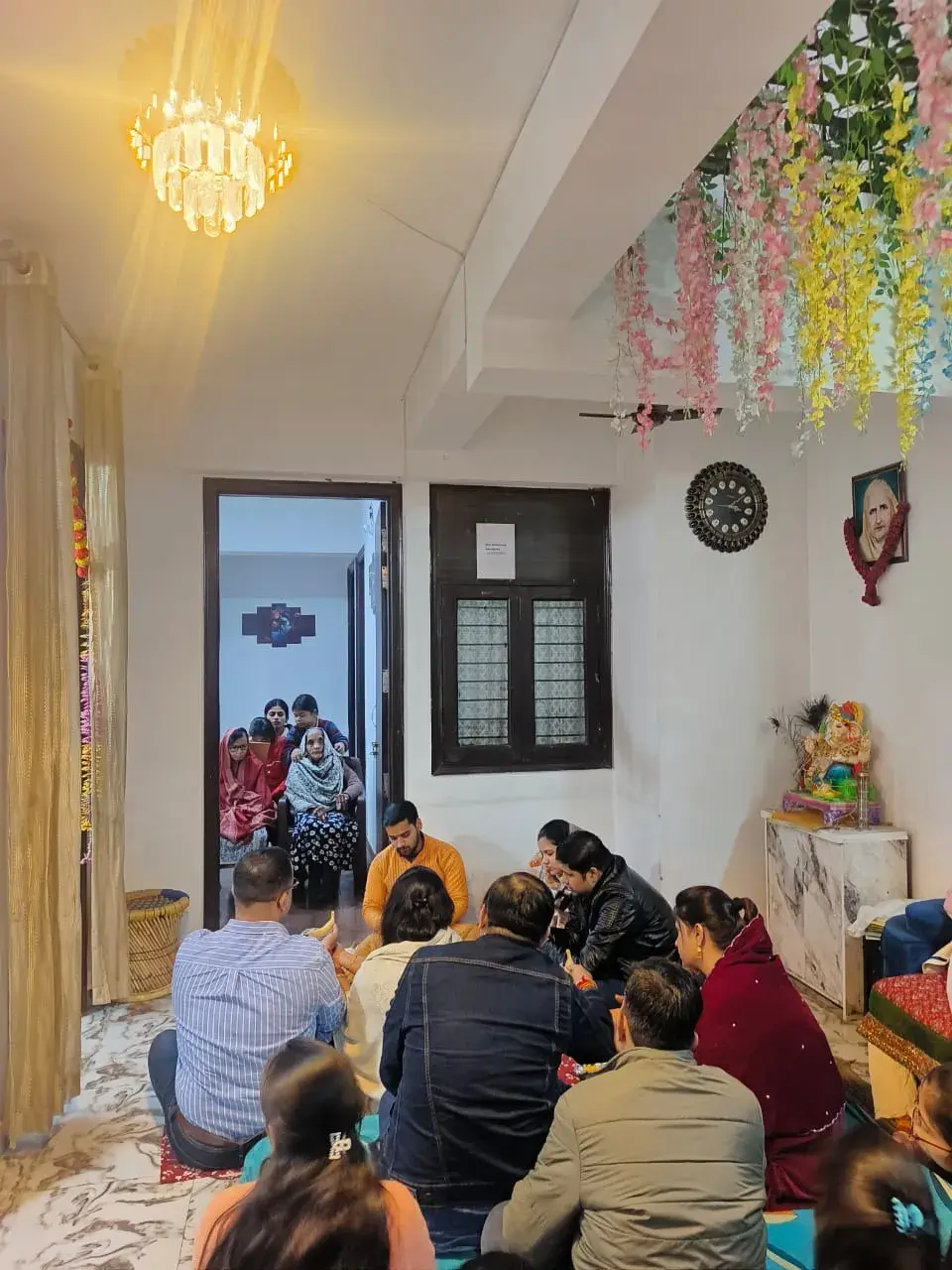 Elders and staff participating in Satyanarayan Katha at Ashirwad